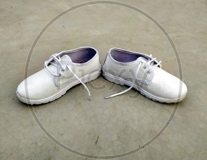 children school white shoes put on the road