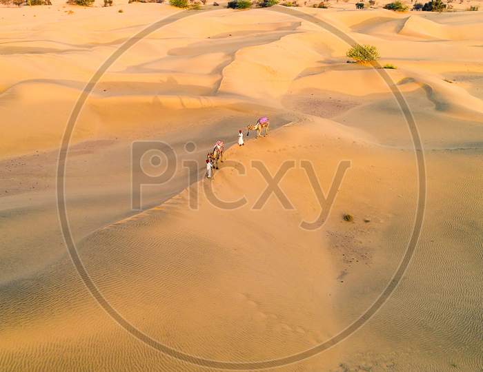 Aerial View Of Jaisalmer Sam Sand Dunes, Man Walking With Camel, Rajasthan, India, Tourism, Summer, Background - Image