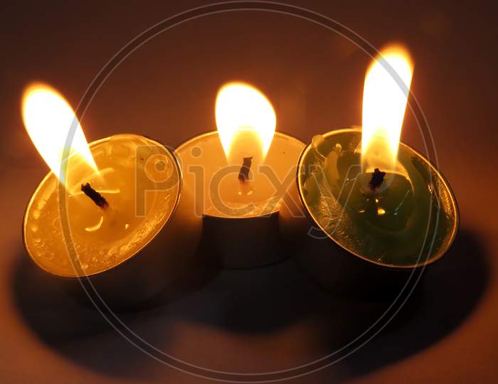 Burning candle on black Background,Isolated Burning Candles.Temple Candles.Burning candle flame,
