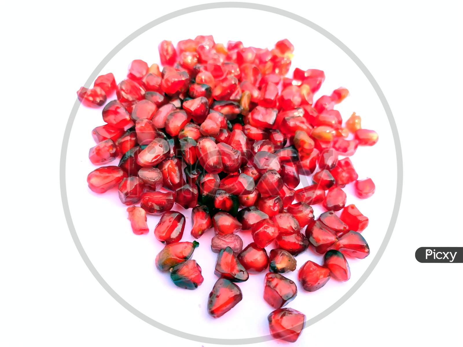 fresh red pomegranate seed isolated on white background