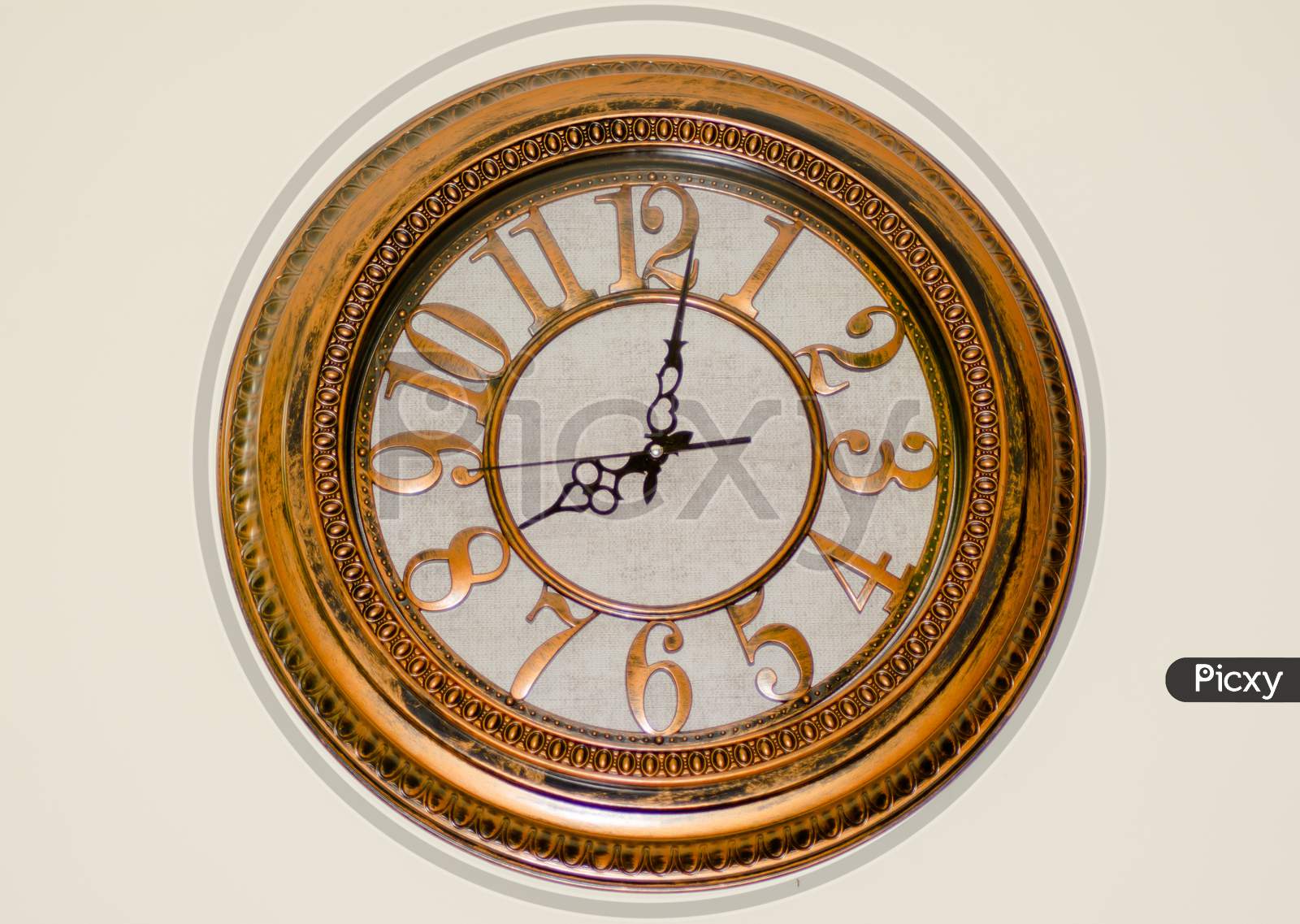 antique regulator wall clock hanging on the wall