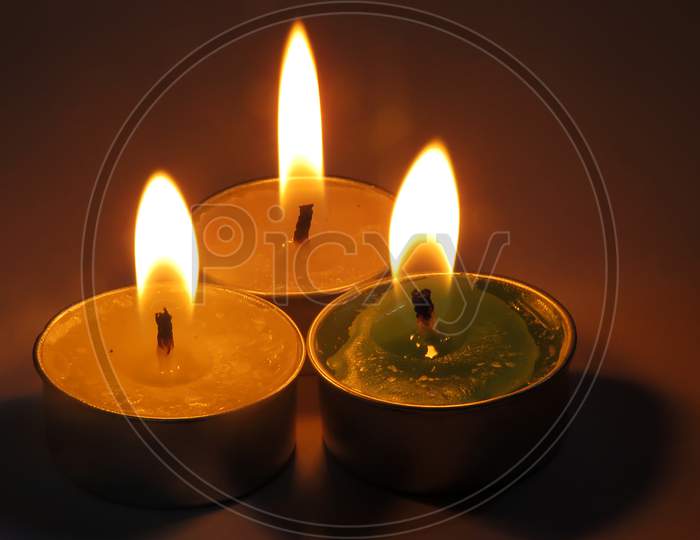 Burning candle on black,Isolated Burning Candles.Temple Candles.Burning candle flame,