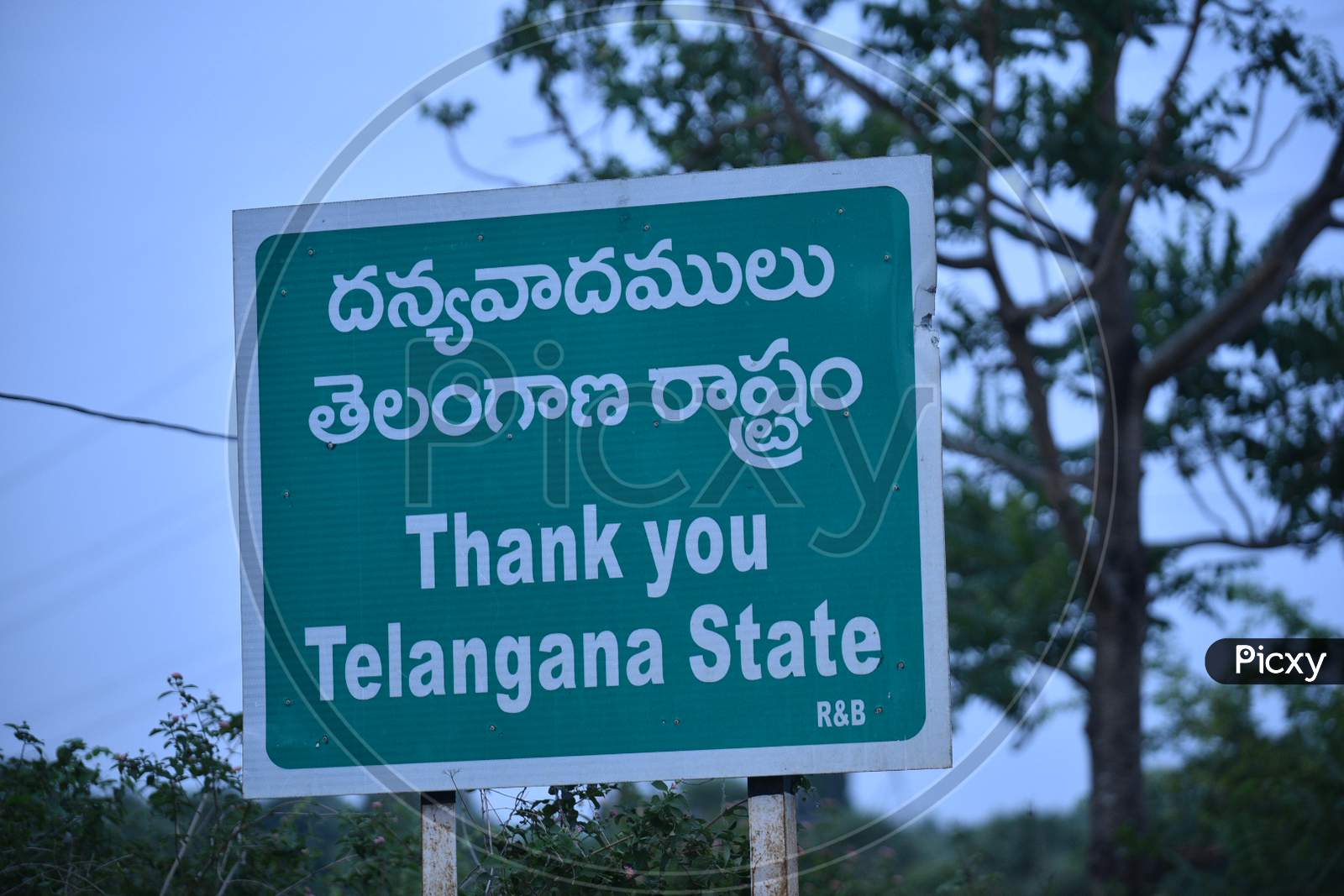 A signboard is pictured at the Telangana State-Andhra Pradesh border During Nationwide Lockdown Amidst Coronavirus Or COVID-19 Pandemic in Aswaraopeta, Telangana