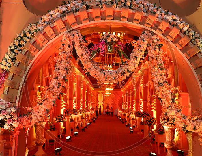 Luxurious Indian Wedding Decoration Entrance Decorated With Lighting And Flowers, Selective Focus - Image