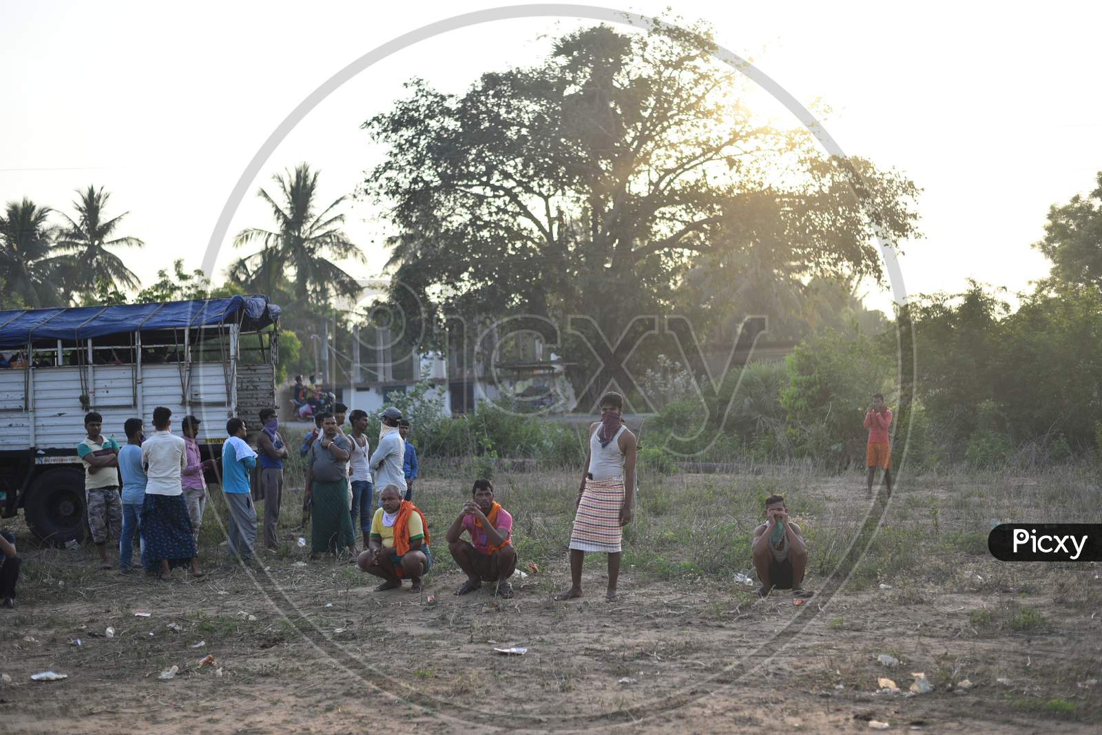 A Migrant workers from Odisha, West Bengal and Bihar waits for clearance at Telangana-Andhra Pradesh Border to move to their hometowns , Aswaraopet, Telangana, May 16,2020