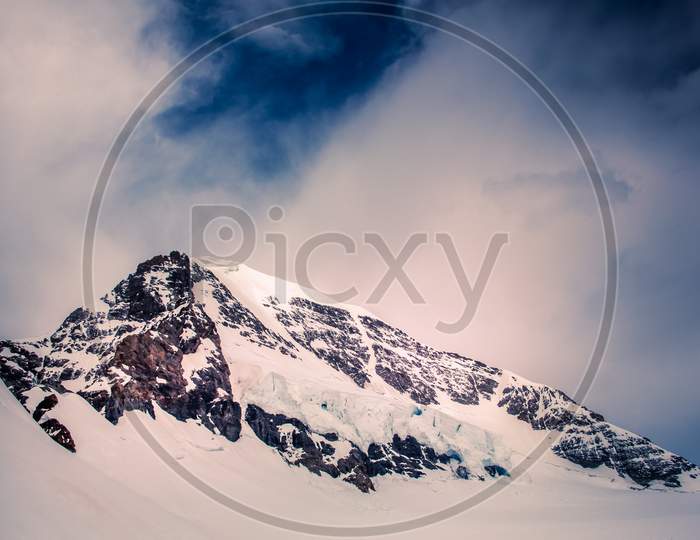 Jungfraujoch, Top Of Europe - The Swiss Mountain Experience. A Beautiful Peak Snow Mountain View
