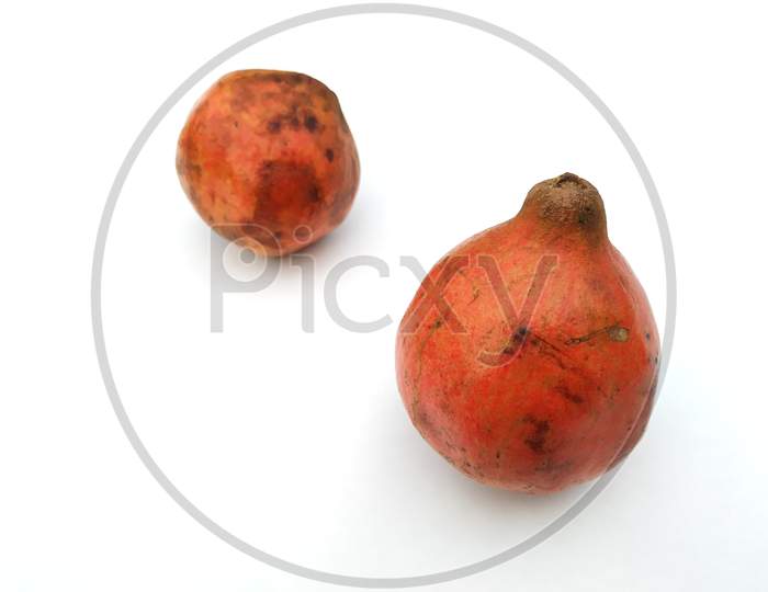 a fresh sweet pomegranate isolated on white background