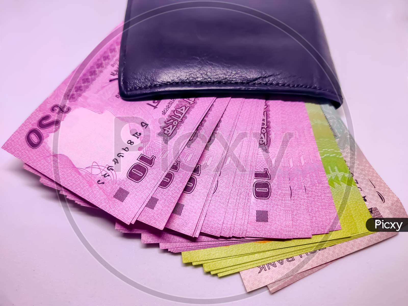 Black Wallet Full Of Bangladeshi Bank Notes.