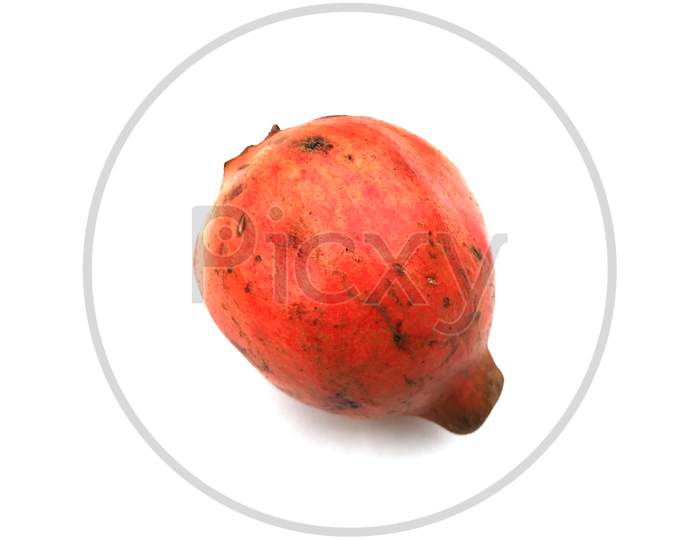 a fresh sweet pomegranate isolated on white background