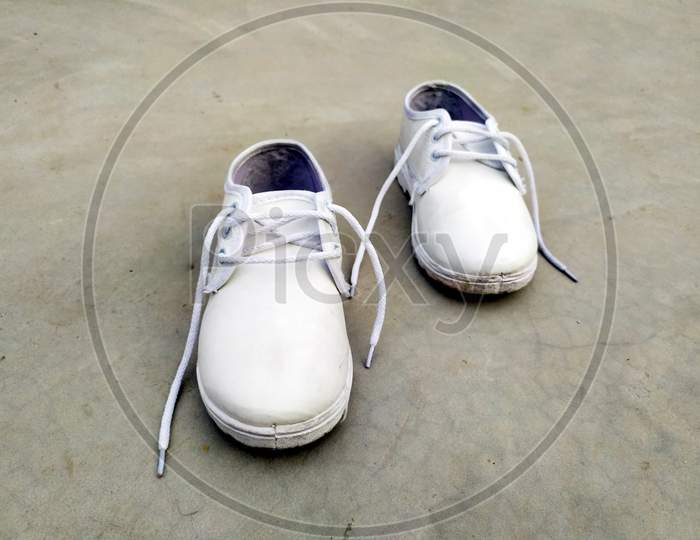 children school white shoes put on the road