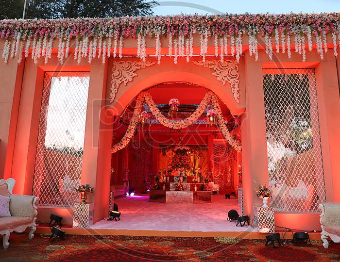 Luxurious Indian Wedding Decoration Entrance Decorated With Lighting And Flowers - Image