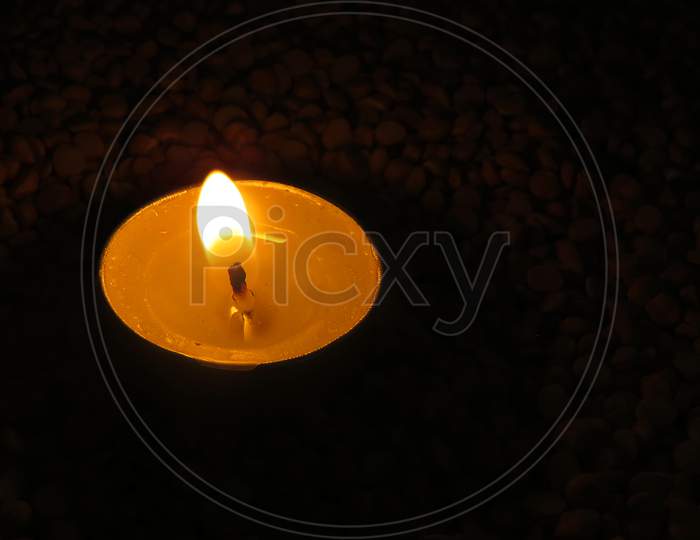 Candles on Split pea background,Isolated candles on the seeds,Burning Candles.