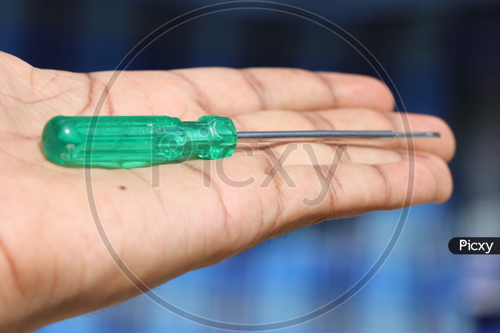 Screwdriver With Green Handle Which Is Flat Type