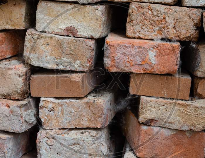 Uneven Old Bricks Stacked Outside