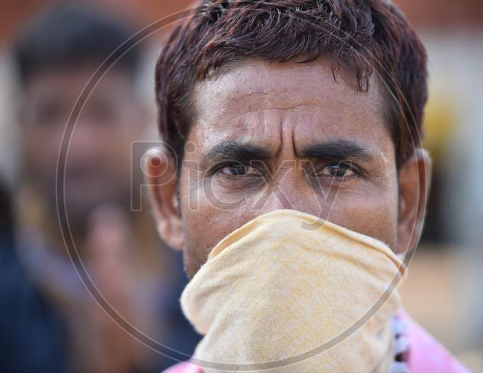A Migrant worker from Odisha, West Bengal and Bihar waits for clearance at Telangana-Andhra Pradesh Border to move to their hometowns , Aswaraopet, Telangana, May 16,2020