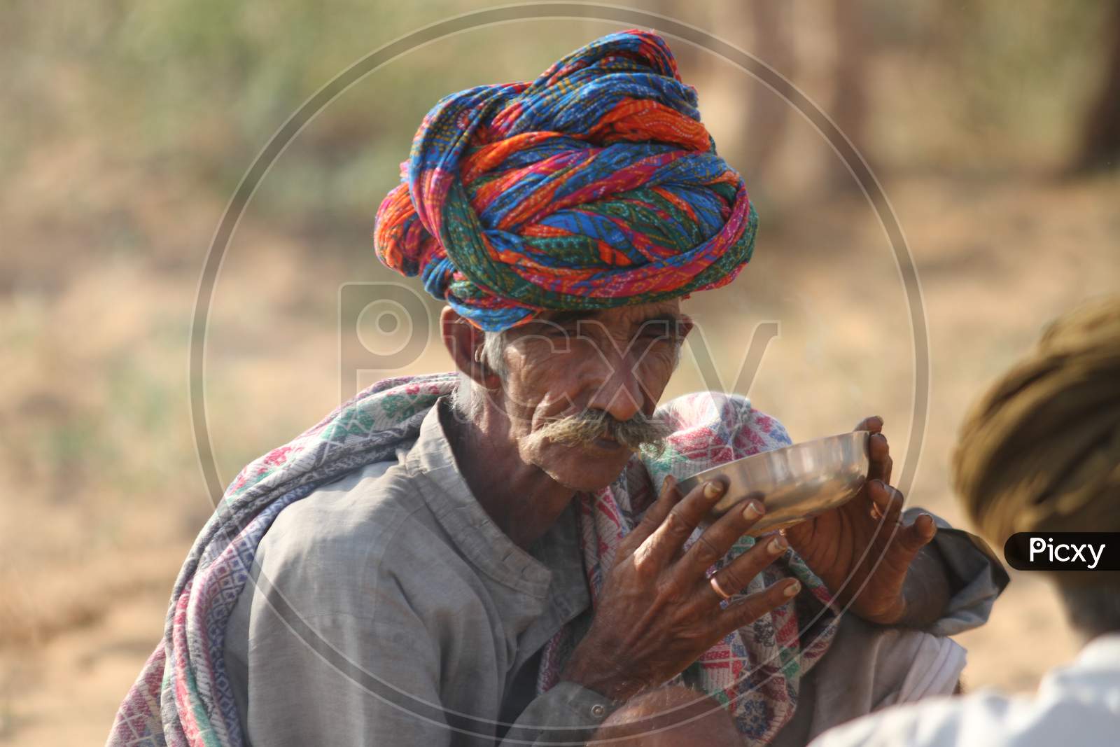 Rajasthani Camel Traders Wearing Traditional Turban At Pushkar Camel Fair, Pushkar, Rajasthan