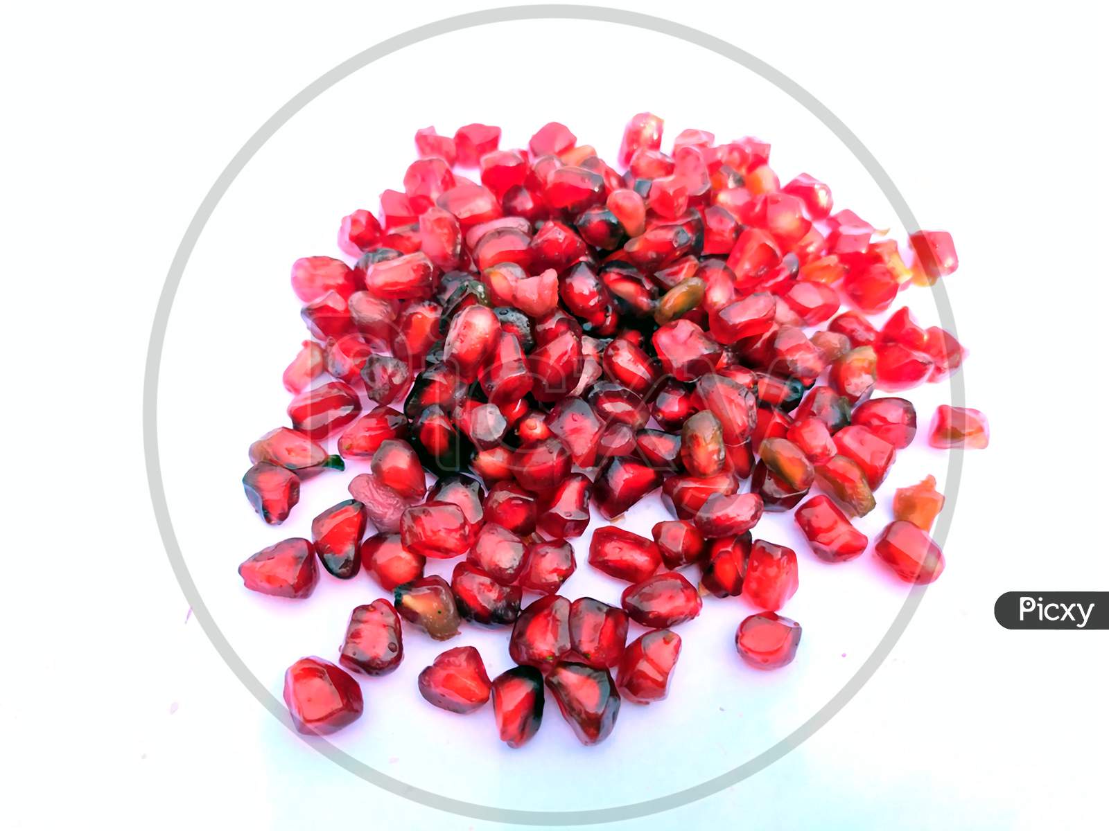 fresh red pomegranate seed isolated on white background