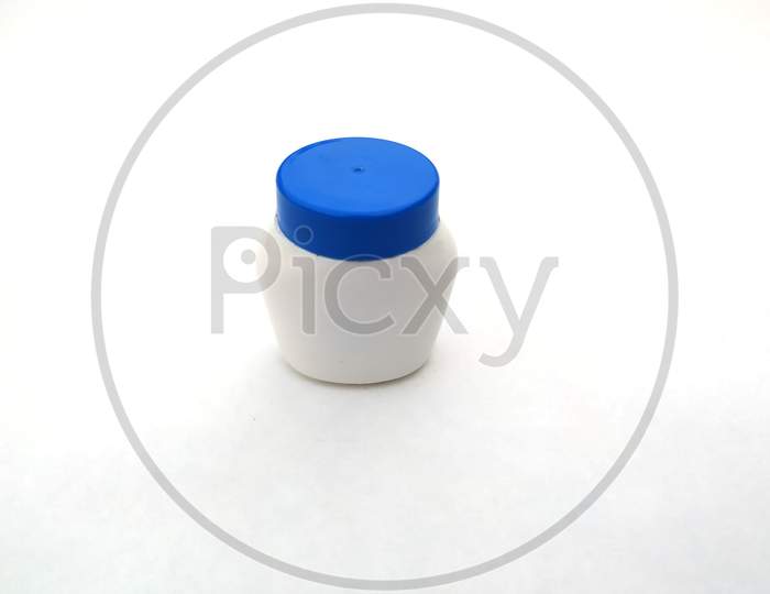 round plastic jar for cosmetics cream isolated on white background