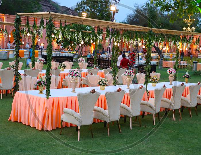 Jodhpur, Rajasthan, India - May 18Th, 2018: Luxurious Long Dinner Tables And Chairs, Rich Decorated With Flowers , Indian Wedding Arrangement Setup - Image