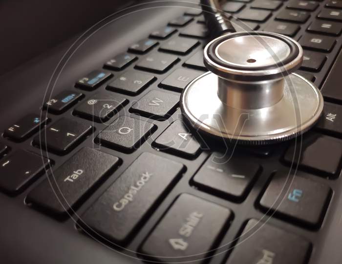 Medical Stethoscope On Laptop Keyboard