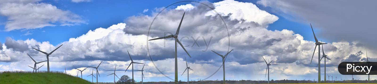 Detailed panorama of wind energy parks in northern germany close to the north sea