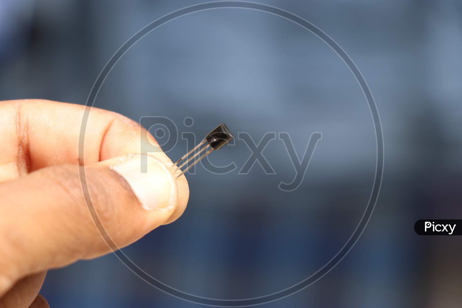 Small Electronic Component Or Hardware Held In Hand