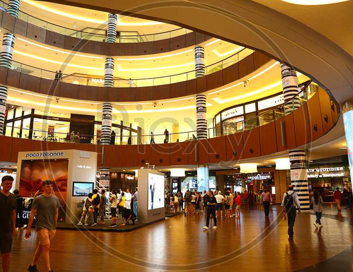 Dubai, United Arab Emirates - June 18Th, 2019: The Dubai Mall Inside View With People All Around Walking And Shopping - Image