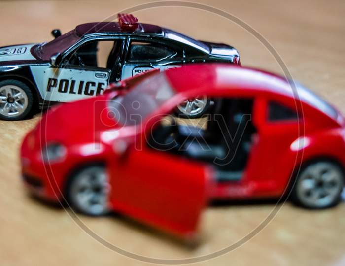 Mattel toy car and truck, toy model car on a wooden table in soft focus