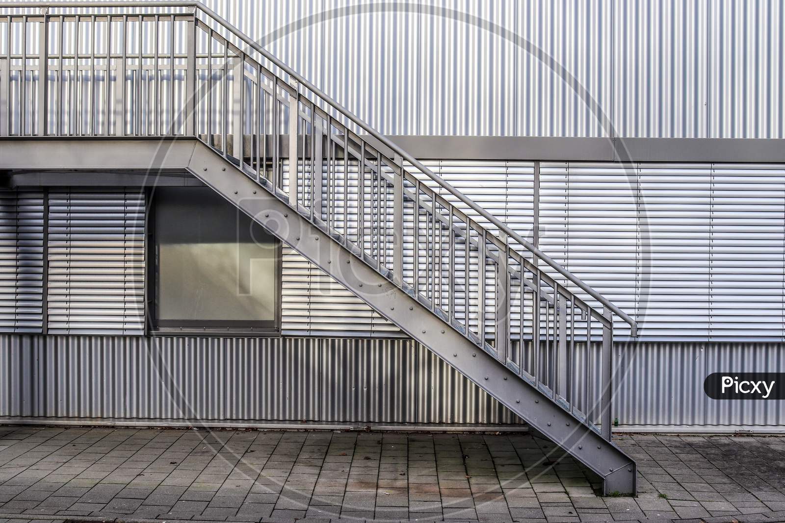 Different outdoor views of concrete, wooden and metal stairways