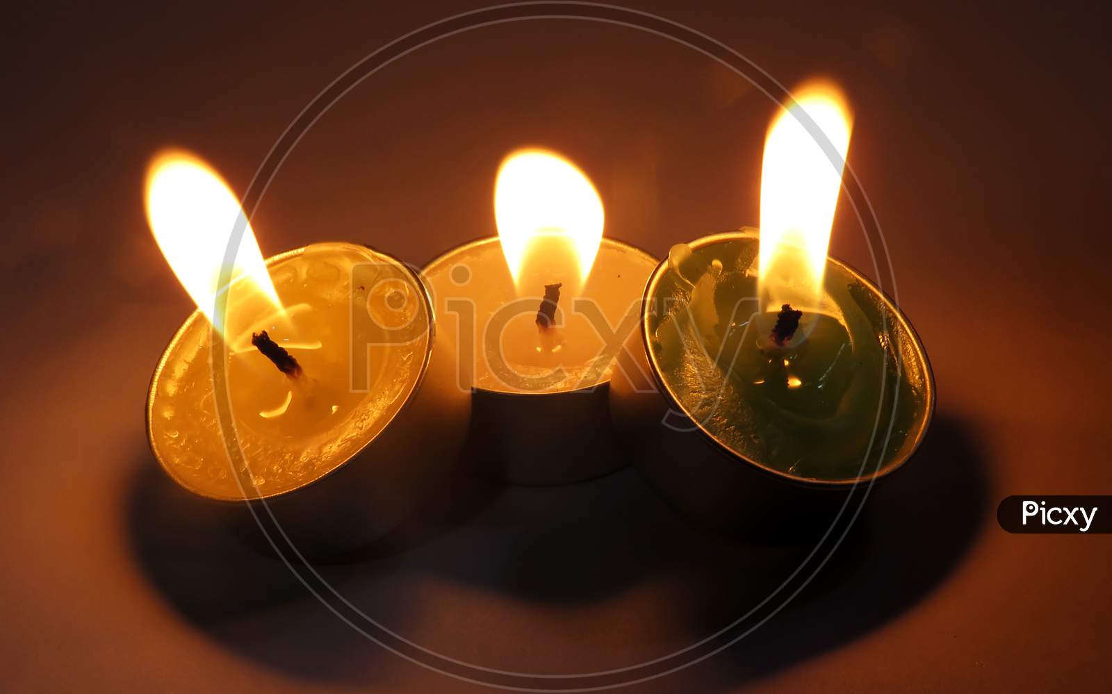 Burning candle on black Background,Isolated Burning Candles.Temple Candles.Burning candle flame,
