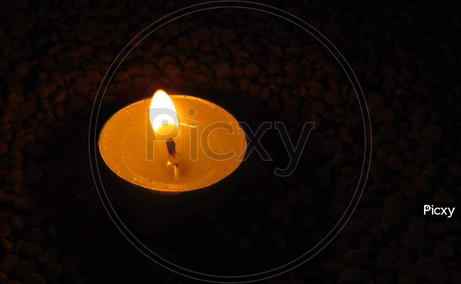 Candles on Split pea background,Isolated candles on the seeds,Burning Candles.