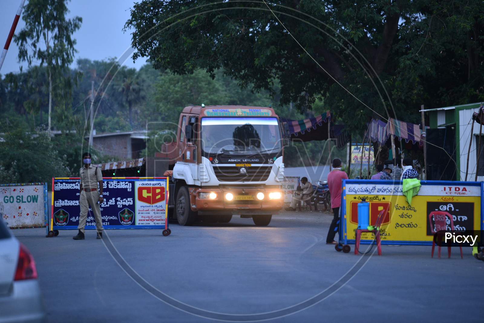 Heavy Trucks Carrying Industrial Goods Crossing  the Telangana- Andhra Pradesh Border After  Clearance During During Nationwide Lockdown Amidst Coronavirus Or COVID-19 Pandemic In Aswaraopeta, Telangana