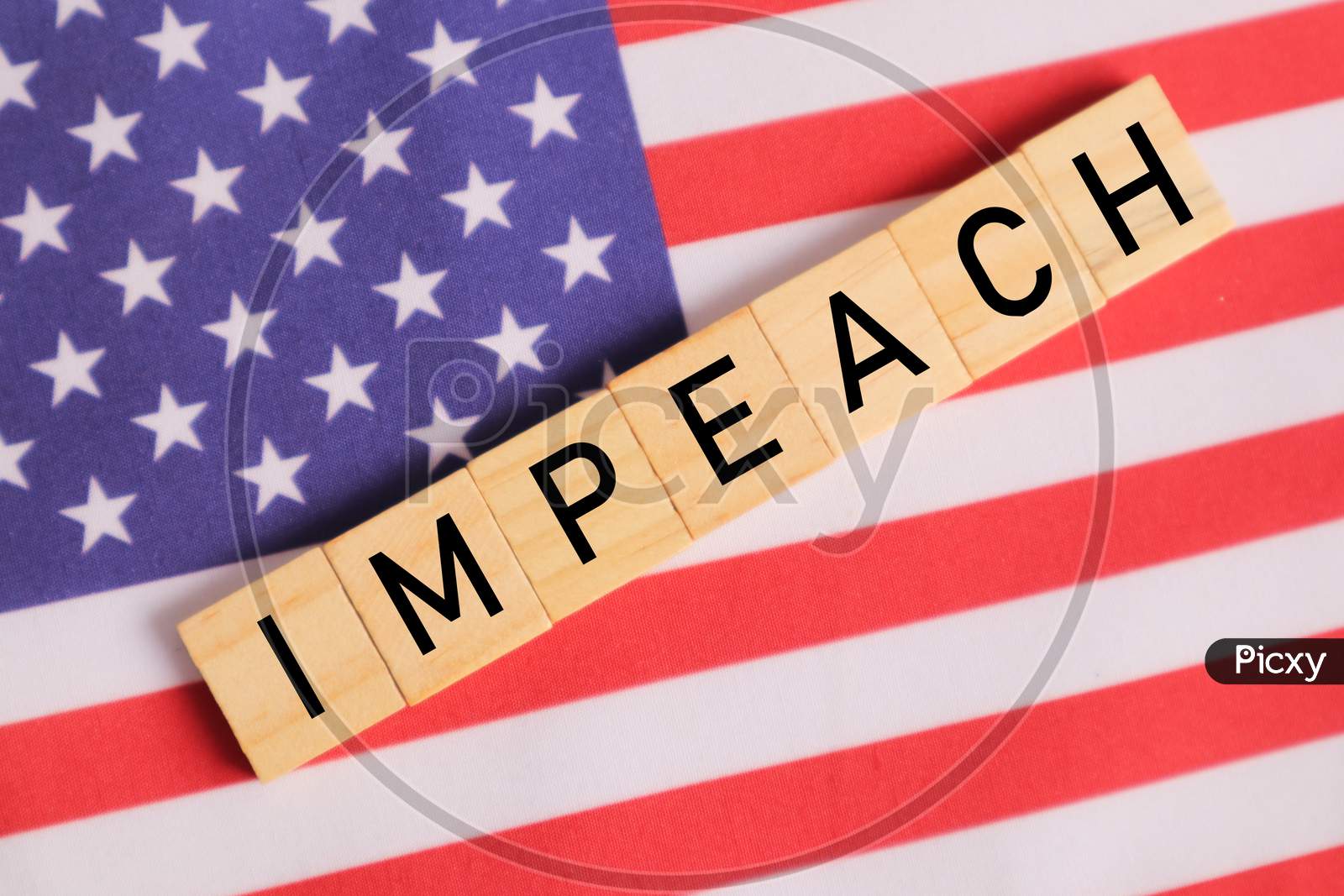 Concept Of Us Politics, Impeachment Showing With Us Flag With Impeach In Wooden Letters.