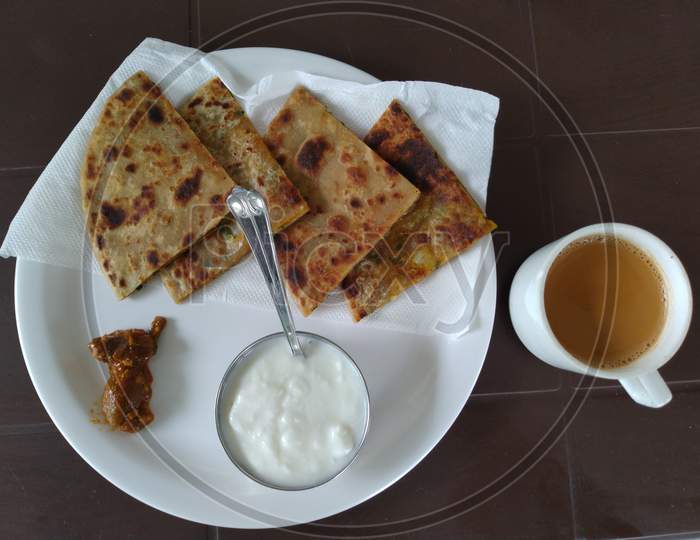 Tasty Indian breakfast, Parathas with curd and tea, Indian Breakfast