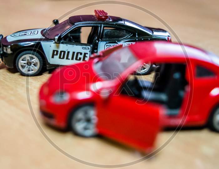 Mattel toy car and truck, toy model car on a wooden table in soft focus