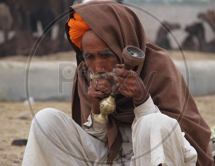 Rajasthani Camel Traders Smoking Hookah At Pushkar Camel Fair, Pushkar
