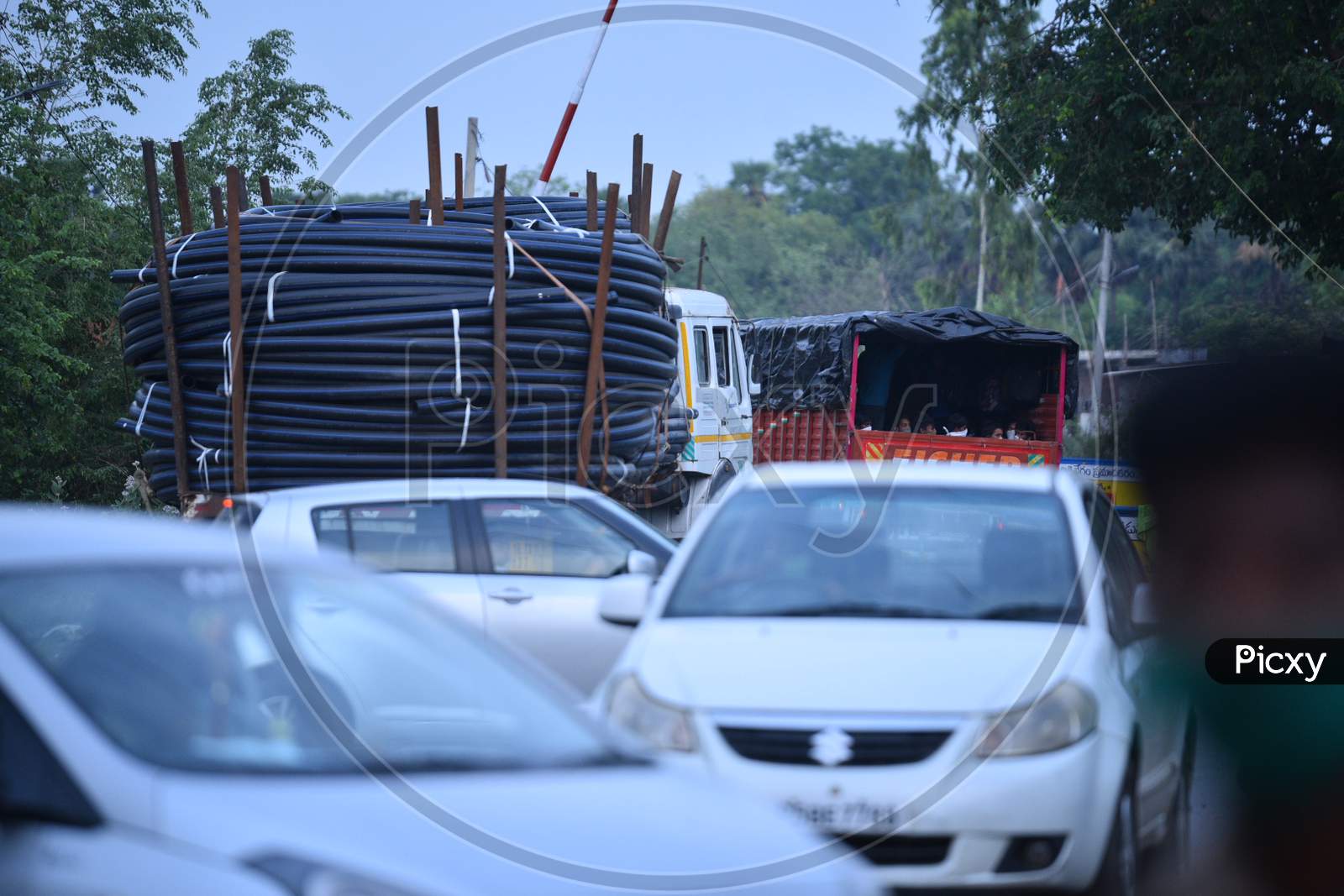 Heavy Trucks Carrying Industrial Goods Wait At Telangana- Andhra Pradesh Border For Clearance During During Nationwide Lockdown Amidst Coronavirus Or COVID-19 Pandemic In Aswaraopeta, Telangana