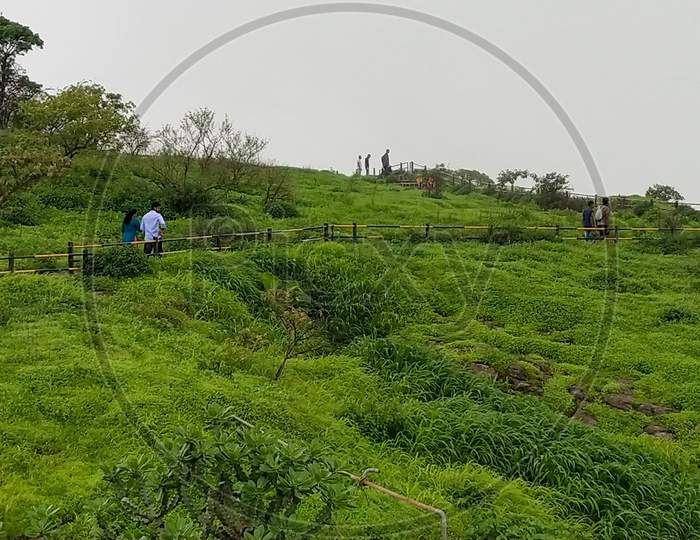 Tourists at sinhagad fort in monsoon