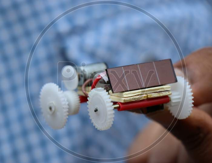 Mini Solar Car Made Of Plastic Gears And Powered By Battery And Solar Panel