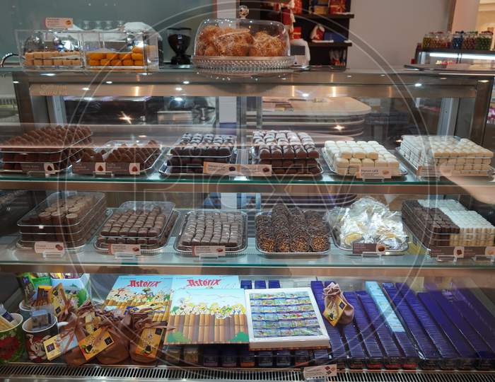 Close Up Of Several Chocolate Sweets In A Shop. Chocolate Candy In A Store Window. Stand With Chocolates. Collection Of Delicious Chocolate Candies With Different Fillings. - Dubai Uae December 2019