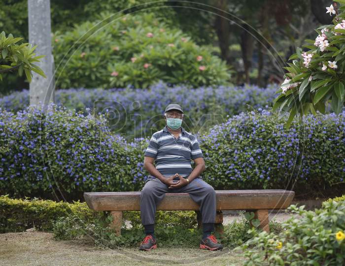 A man performs breathing exercises in Cubbon Park after the state eased lockdown norms during the nationwide lockdown to prevent the spread of coronavirus (COVID-19) in Bangalore, India.