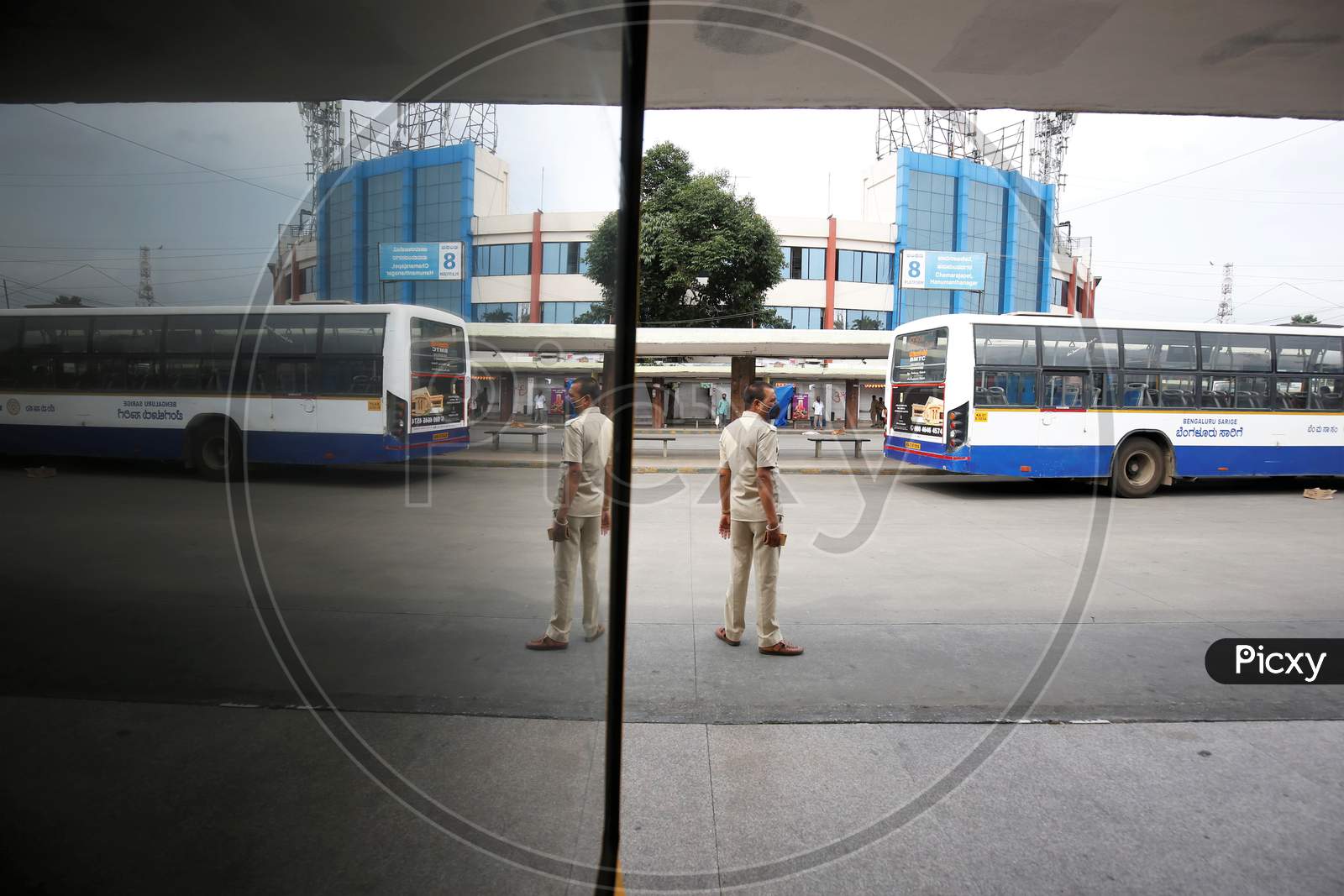 A ticket collector waits for passengers in a bus station after the state eased lockdown norms during the nationwide lockdown to prevent the spread of coronavirus (COVID-19) in Bangalore, India.