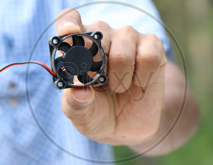 Cpu Cooler Fan Or Dc Fan Used In Laptop Cooling Held In Hand