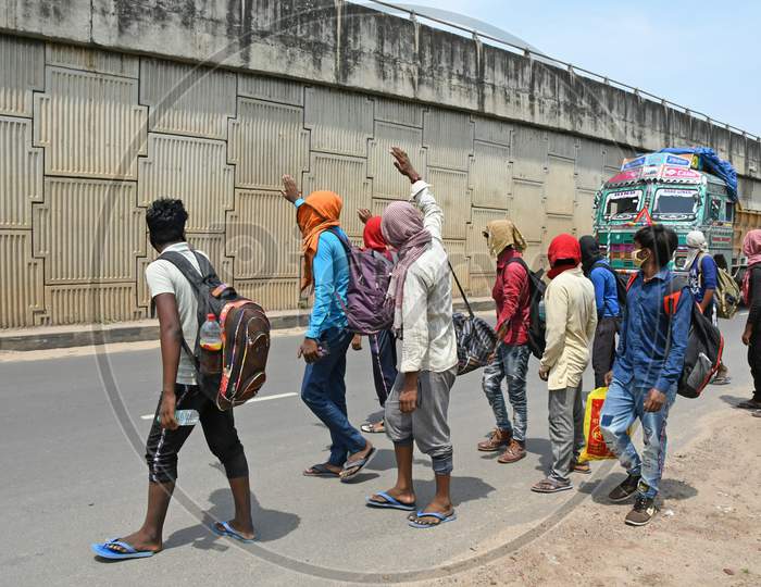 Migrant workers stranded due to lockdown in the emergence of Novel Coronavirus (COVID-19) are walking from Barrackpore (West Bengal) to Bihar on their own initiative. Migrant workers are walking on the 2 no National Highway towards their destination. At Burdwan Town.