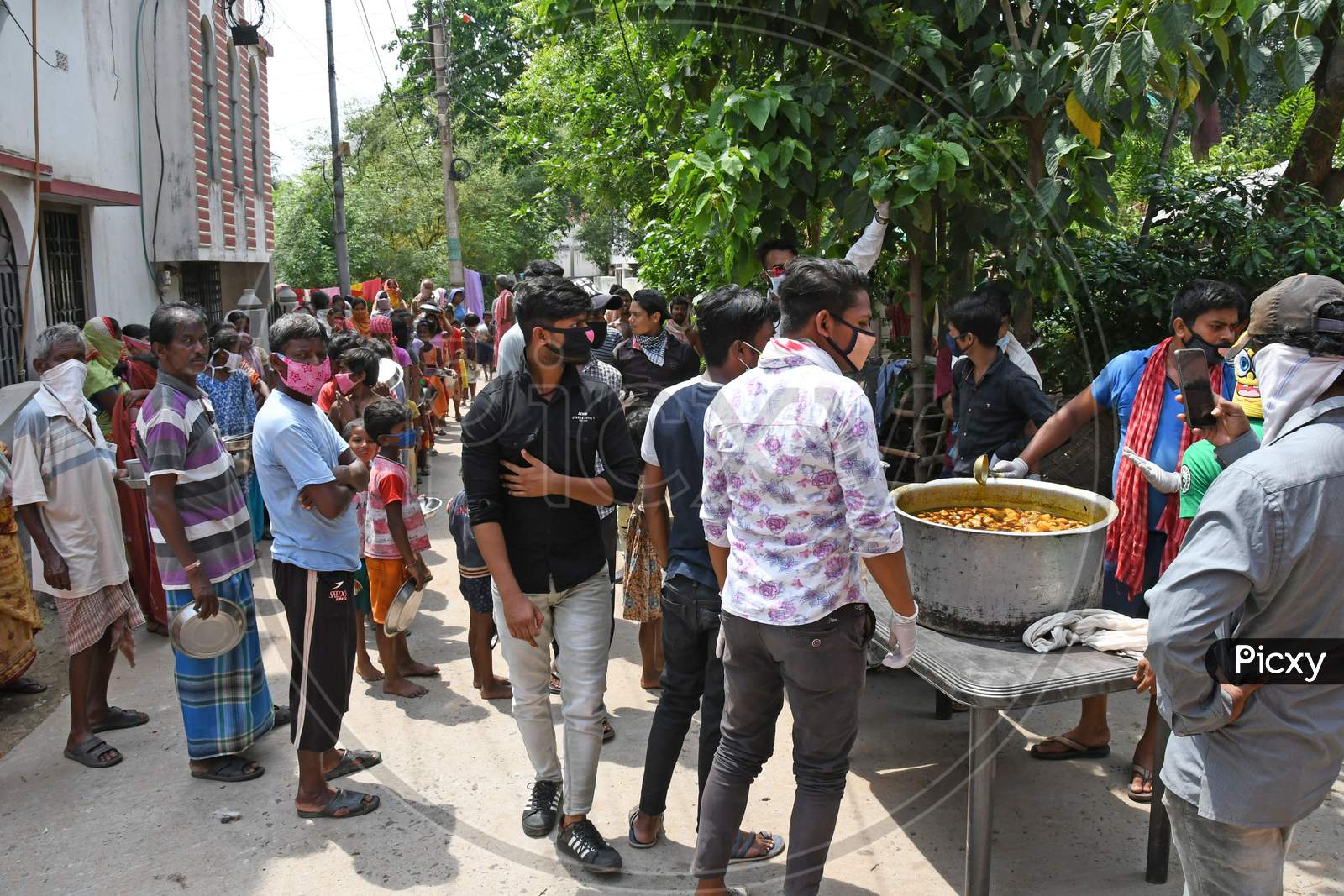 Cooked food is being given to family members who are unable to earn money due to lockdown in the emergence of Novel Coronavirus (COVID-19). At Burdwan Town.