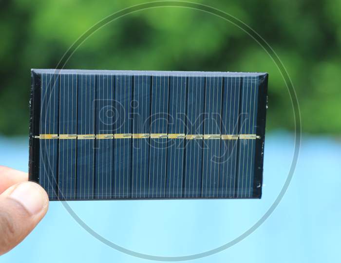 Mini Solar Panel Also Called As Mini Solar Cell Which Is Very Small In Size Held In Hand Which Produces Electricity When Exposed To Sunlight Is Used To Charge Mini Solar Powered Devices