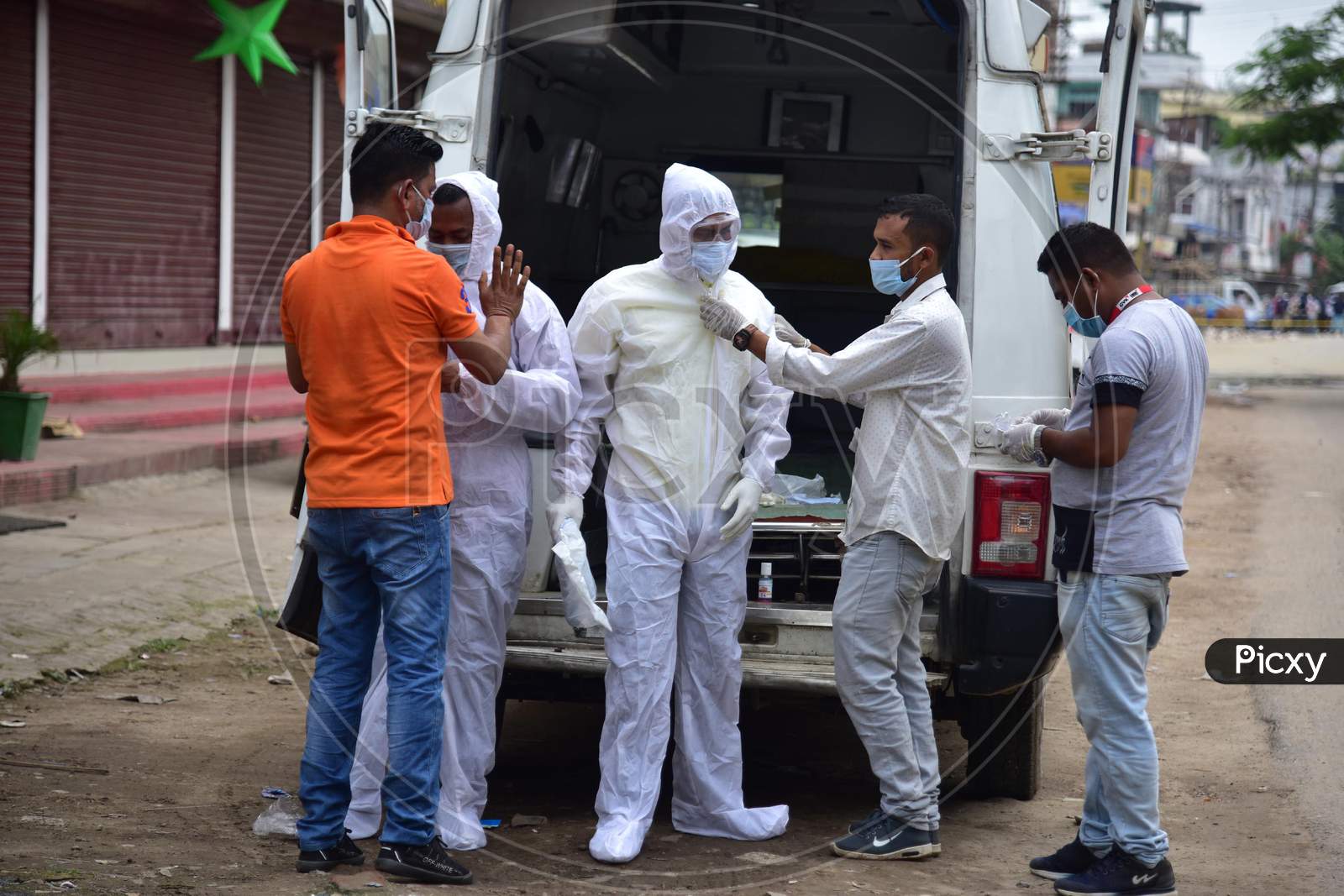 Health Workers Wear Personnel Protective Equipment Kit (Ppe) Before Heading To Bring A Covid19 Positive Patient To An Ambulance For Shifting Him To Guwahati from Nagaon