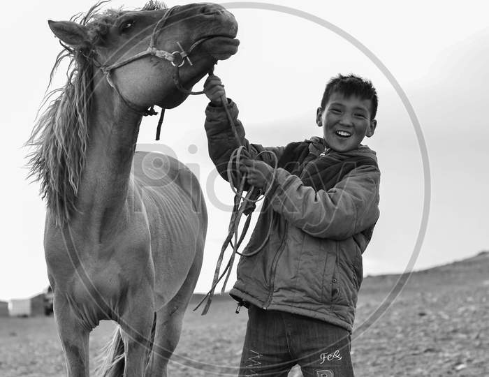 Mongolian horse rider and her horse
