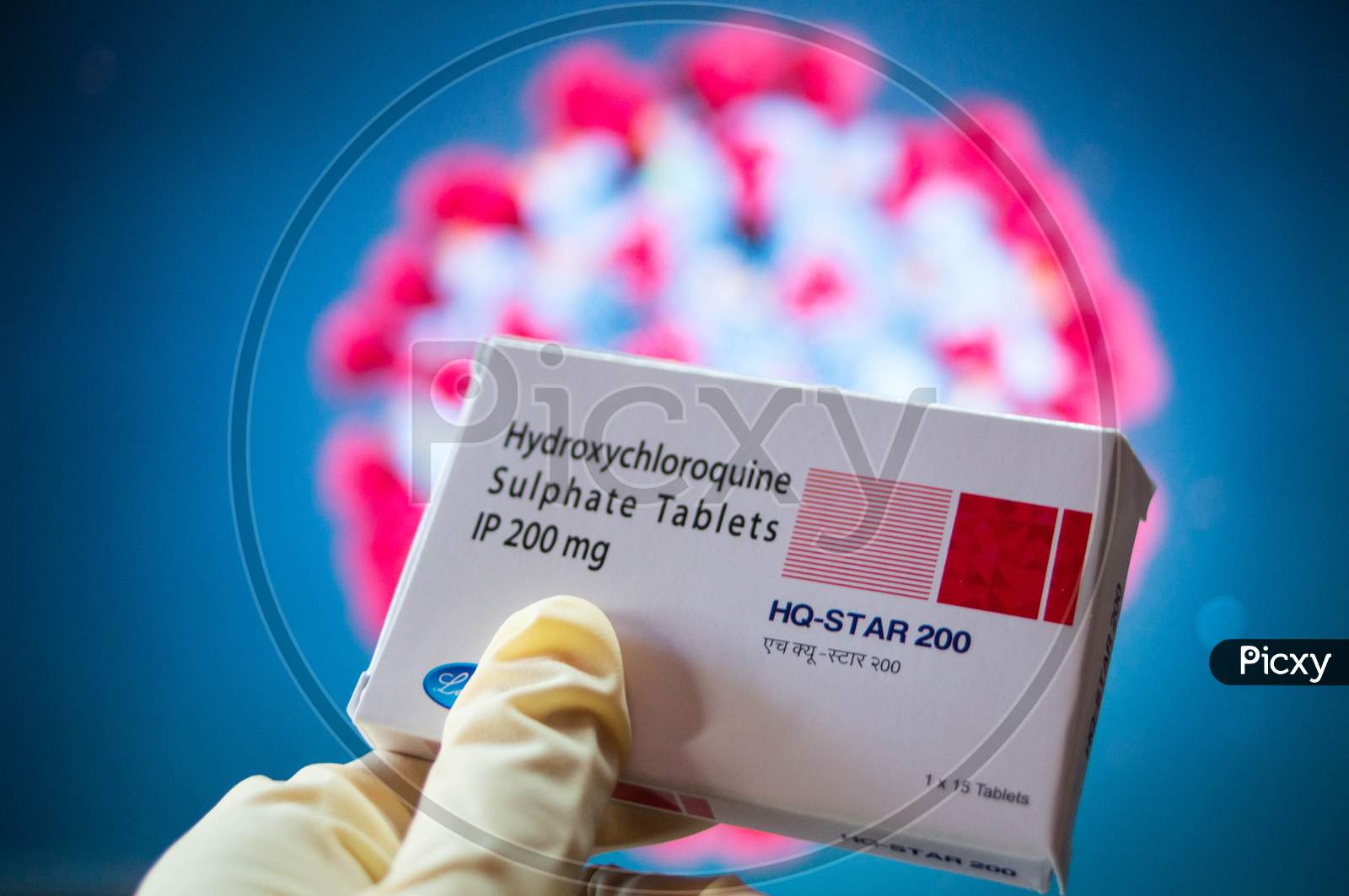 Hydroxychloroquine Sulphate Tablets With Coronavirus Symbol In Background