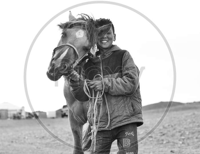 Mongolian horse rider and her horse